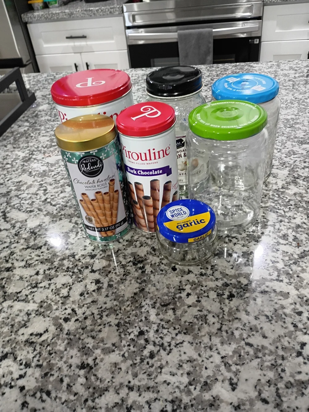 Assorted Glass And Aluminum Storage Jars with Colorful Lids